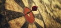 Dart hitting bullseye on dartboard, showcasing precision and focus in a competitive game environment, copy space for Royalty Free Stock Photo