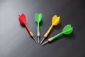 Dart sports branch, dartboard and colorful dart arrows on black ground Royalty Free Stock Photo