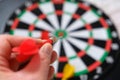 Dart sports branch, dartboard and colorful dart arrows on black ground Royalty Free Stock Photo