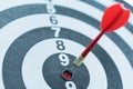 Dart target arrow hitting on bullseye with sun light Royalty Free Stock Photo