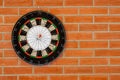 Dartboard on brick wall