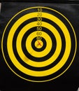 Dartboard with dart arrow in bullseye, close up Royalty Free Stock Photo