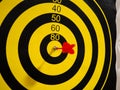 Dartboard with dart arrow in bullseye, close up Royalty Free Stock Photo