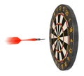 Dartboard with dart flying in aim