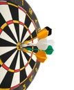 Dartboard with darts in aim