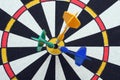 Dartboard with darts in aim