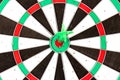 Dartboard with darts on white background, closeup. Purpose concept