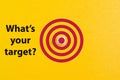 Dartboard drawn on yellow background with question WHAT`S YOUR TARGET Royalty Free Stock Photo