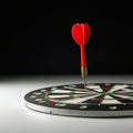 A dartboard with a red dart embedded precisely in the bullseye. The dartboard Royalty Free Stock Photo