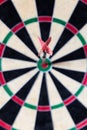 Dartboard with Steel-darts in bullseye