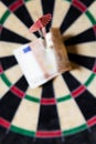Dartboard with Steeldarts and euro in it