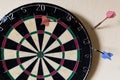 Dartboard with Steeldarts in the wall