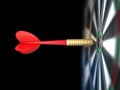 Darts arrow in bull's-eye