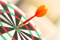 Darts arrow hitting in the target center of dartboard. concept business goal to marketing success. Royalty Free Stock Photo