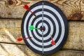 Old dartboard with darts, closeup Royalty Free Stock Photo