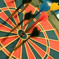 Darts arrows in the target center. Selective focus