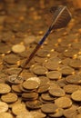 Darts on a heaped of gold coins Royalty Free Stock Photo