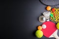Darts, Racket table tennis, ping pong ball, Shuttlecocks, Badminton racket and Tennis ball on black background.Sport concept, Cop