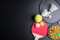 Darts, Racket table tennis, ping pong ball, Shuttlecocks, Badminton racket and Tennis ball on black background.Sport concept, Cop Royalty Free Stock Photo