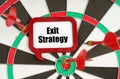 On the darts are darts and a sign with the inscription - Exit Strategy