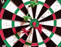 Darts target with darts sticking out