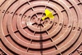 Dart target with numbers from 10 to 1. Dart in the center of the target. Goal achievement concept. Selective focus Royalty Free Stock Photo