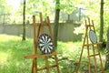 Darts targets on wooden easels in garden. Royalty Free Stock Photo