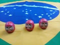 Daruma dolls on a Brazilian flag Royalty Free Stock Photo