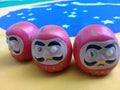 Daruma dolls on a Brazilian flag Royalty Free Stock Photo