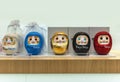 Daruma dolls made of papier-mÃÂ¢chÃÂ© used as roly-poly toy depicting the bodhidharma deity.