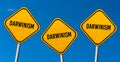 Darwinism - yellow signs with blue sky Royalty Free Stock Photo