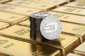 Dash coins laying on stacked gold bars gold ingots rendered with shallow depth of field. Concept of highly desirable cryptocurre