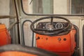 Dashboard and steering wheel of the tractor