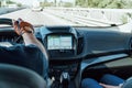 Dashboard View And GPS Map Of Modern Car With Hands Of Driver On Steering Wheel Royalty Free Stock Photo