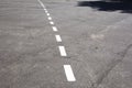 Dashed line. Markings on the road. White dotted line on the asphalt