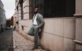 Dashing Black Man in Suit on Narrow Road