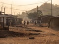 Street of the village. Domestic animals together with people walking the street