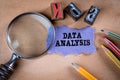 Data Analysis. Magnifying glass, stationery and note paper