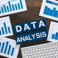 Data analysis tableau with blue themed graphs on desk, promising insights in productivity buzz Royalty Free Stock Photo