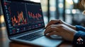 Data analyst working on laptop, analyzing financial charts and graphs, focused on data visualization and insights for decision