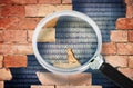 Data Breach concept with cracked brick wall and binary code - Concept seen through a magnifying glass Royalty Free Stock Photo