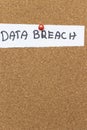 Data breach notice pinned on a cork board, highlighting security concerns in the digital age. This image signifies vulne Royalty Free Stock Photo