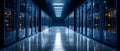 Data center corridor with high-tech servers illuminated by cool blue lights at night Royalty Free Stock Photo