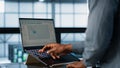 Data center engineer coding on notebook, adjusting power settings Royalty Free Stock Photo