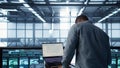 Data center engineer coding on notebook, adjusting power settings Royalty Free Stock Photo