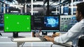 Data center engineer with paraplegia using AI algorithms on green screen PC Royalty Free Stock Photo