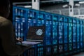 Data center engineer using AI technology on laptop to do troubleshooting Royalty Free Stock Photo