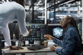 Data center engineers brainstorming, using AI visualization tool Royalty Free Stock Photo