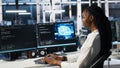 Data center female programmer uses machine learning algorithms to analyze datasets Royalty Free Stock Photo