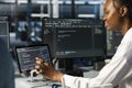 Data center female technician using tablet, coding, managing systems Royalty Free Stock Photo